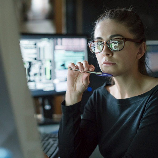 woman in office looking at monitor