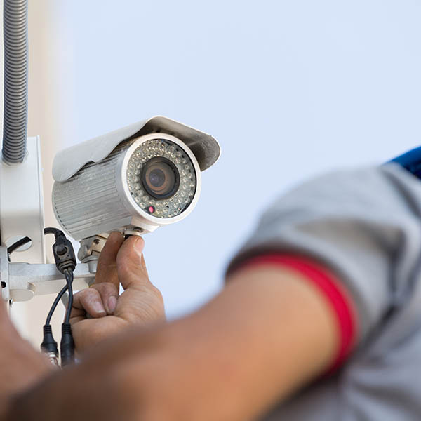 Security camera service man working.